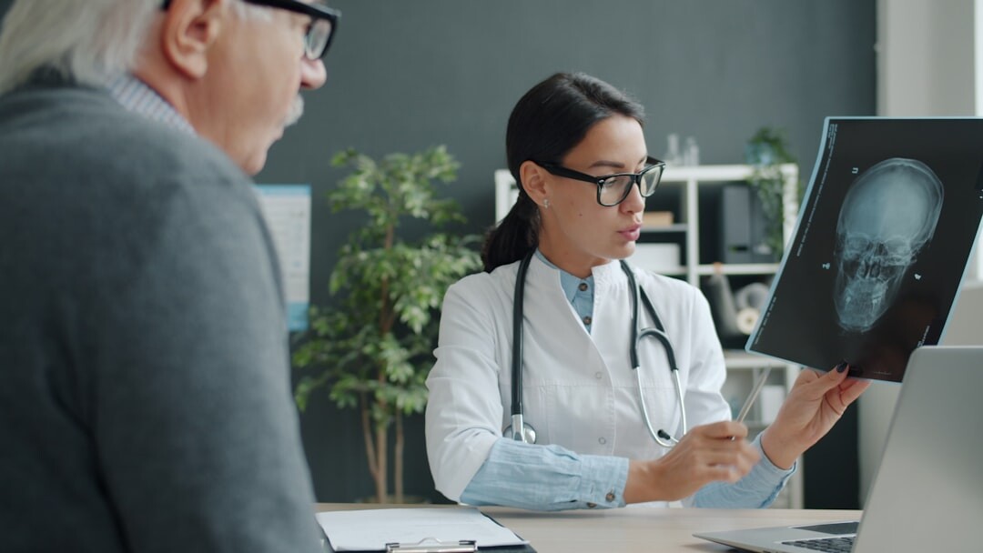 doctor checking elderly patient